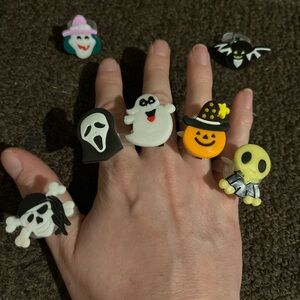 A Set of 7 Adjustable Halloween LED Rings (They light up, blink, etc.)